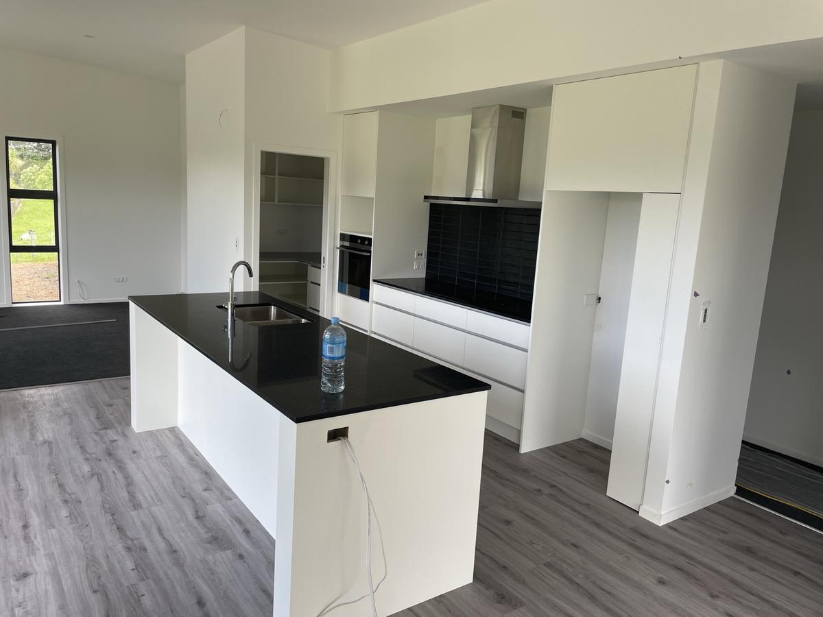 White kitchen with dark island