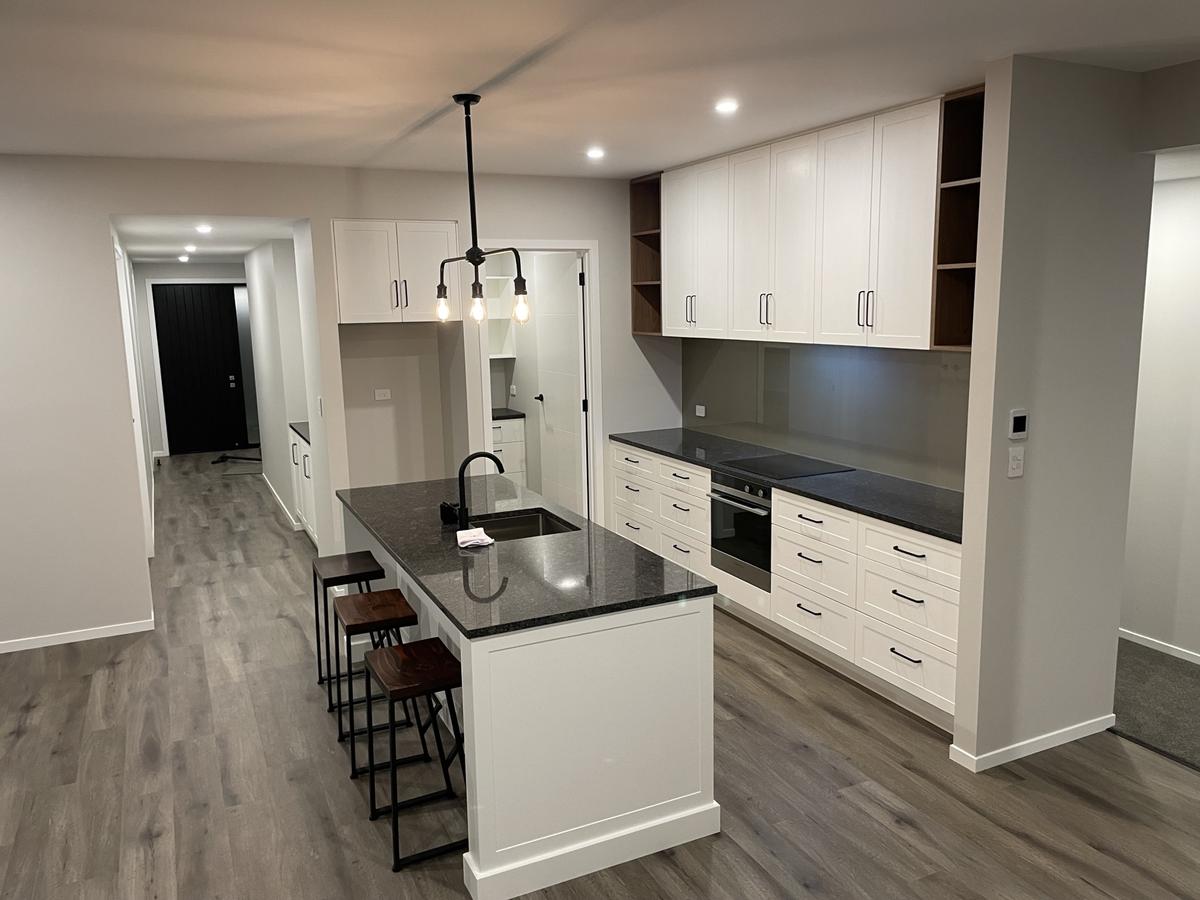 Classic white kitchen with pendant lighting