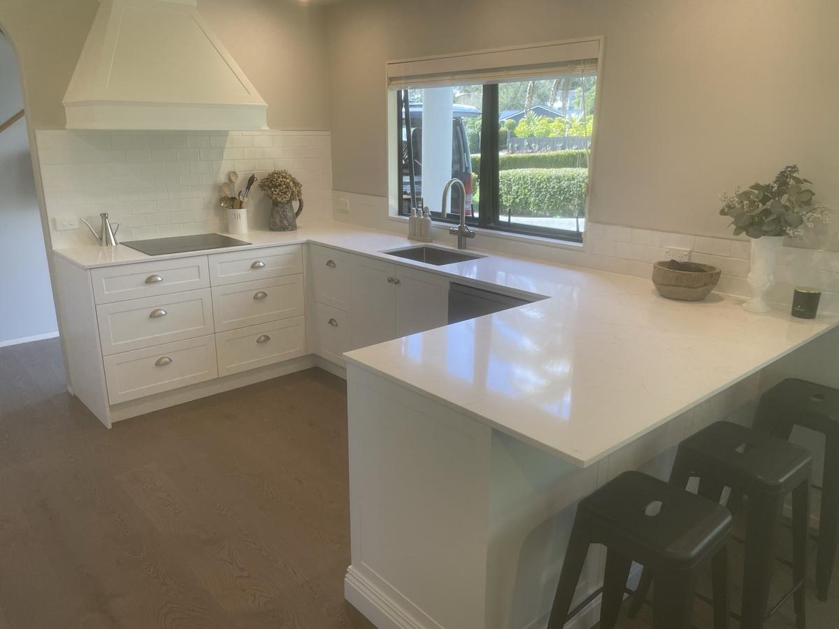 Warm cream kitchen with timber floors